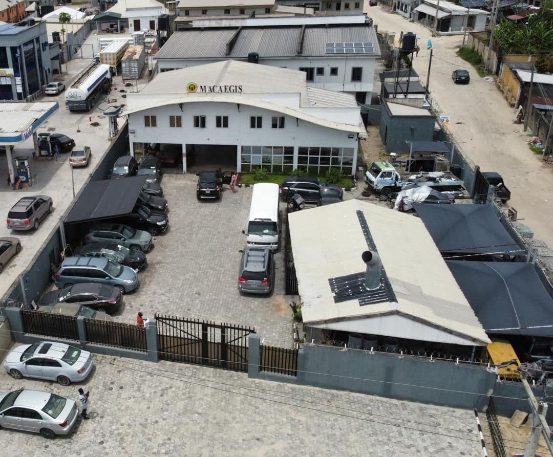 Modern automotive workshop with professional equipment and technicians